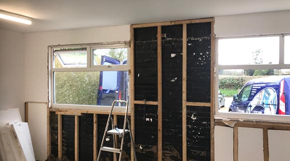 Stripping Back Inside of a Garage in Devizes
